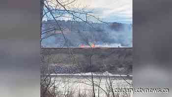 Grassfire near railway tracks under investigation by CP, Calgary Fire Department - CTV News Calgary
