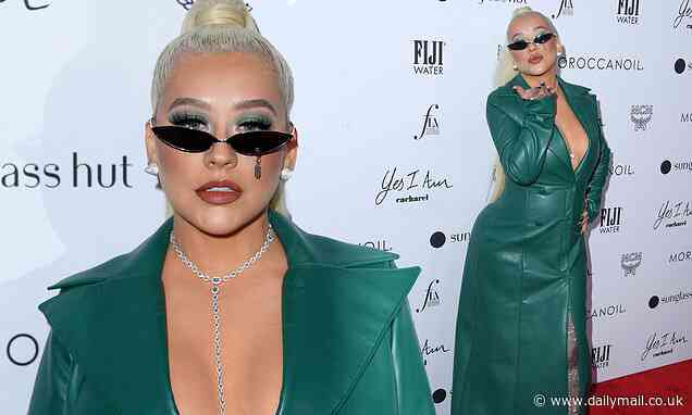 Christina Aguilera dons a plunging emerald dress at The Daily Front Row Fashion Awards in LA - Daily Mail