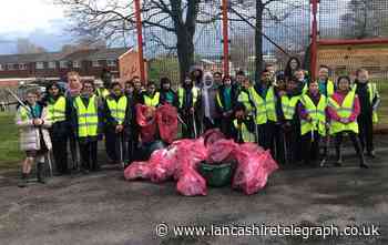 Primary school pupils collect 33 bags of rubbish in community clean up