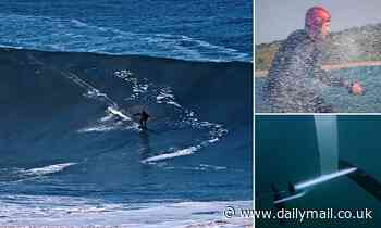 Having a swell time! Kitesurfer tackles a 50ft wave in Portugal on an electric FLYING surfboard