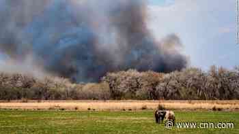 Wildfire damages 150 structures in small New Mexico town, many more are threatened