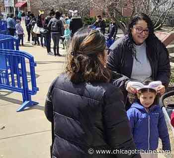Egg hunt event in downtown Aurora gives families early start on Easter holiday - Chicago Tribune