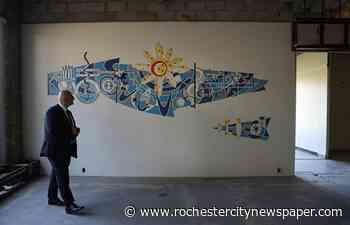 A Kodak mosaic hidden behind drywall for decades is uncovered