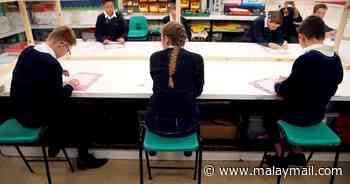 Britain approves Moderna’s Covid shot for 6-11 year-olds - Malay Mail