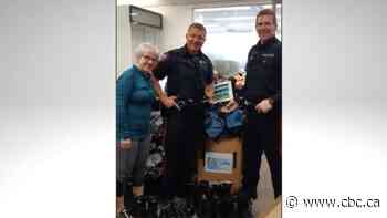 Calgary police officers collect van loads of service clothing for Ukraine - CBC.ca