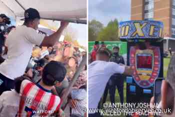 Anthony Joshua shows off strength at Meriden Easter party
