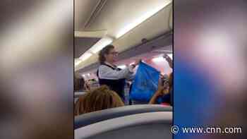 See airline passengers throw away masks as mandate is revoked