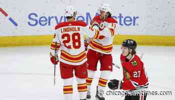 Blackhawks fall to Flames; MacKenzie Entwistle injured, Lukas Reichel sent down - Chicago Sun-Times