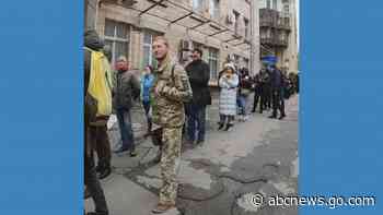 WATCH:  Ukrainians wait in line to buy stamps featuring soldier