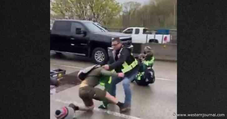 Video: Fed-Up Commuters Drag Climate Protesters Off Highway