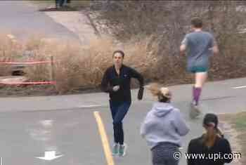 Nurse runs marathon in scrubs, breaks Guinness World Record - UPI News