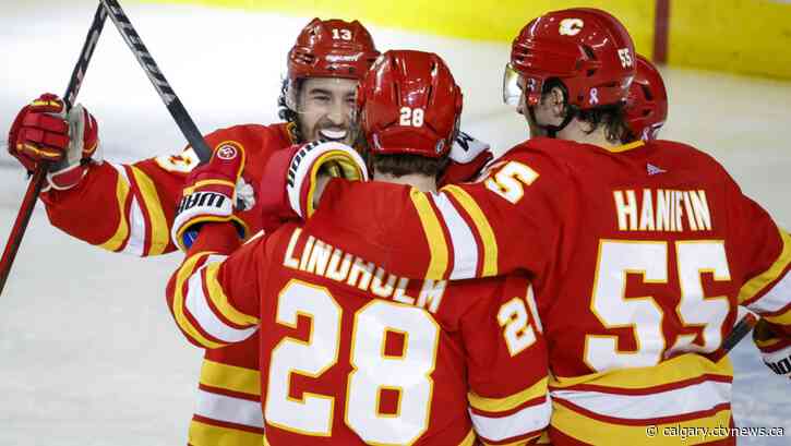 Elias Lindholm hits 40 goals as Calgary Flames down Vancouver Canucks 6-3