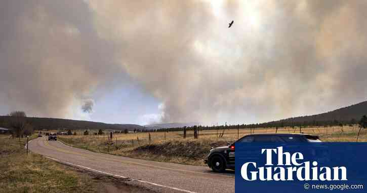 One dead and thousands forced to flee as wildfires sweep across US - The Guardian