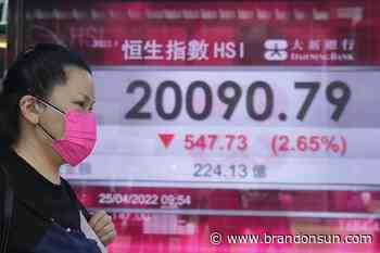 Asian shares fall amid interest rate, earnings worries - The Brandon Sun