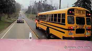 See a near collison between a tractor-trailer and a school bus