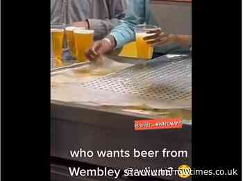 Wembley Stadium staff videoed filling glass from drip tray