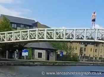 Shocked punters watch as man jumps from bridge into freezing Lancaster canal