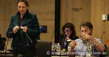 Newcastle Greens councillors Charlotte McCabe and John Mackenzie knit in council meeting in response to NSW Liberal Upper House MP Taylor Martin - Newcastle Herald