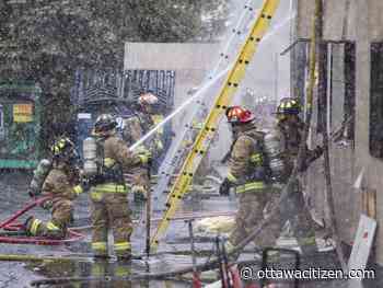 Firefighters battle second-alarm fire at commercial building on Cleopatra Drive