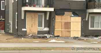 Police seeking public assistance after Calgary townhouse damaged in crash - Global News