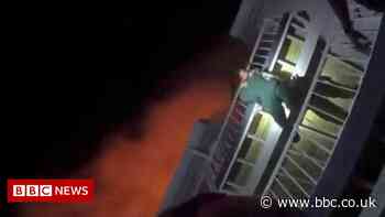 A dangling baby's breath-taking escape from a fire