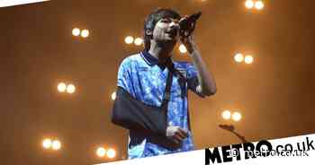 Louis Tomlinson takes to the stage for Wembley gig with arm in sling - Metro.co.uk
