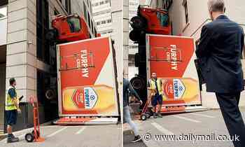 Furphy beer truck is seen wedged at Australia Square, Sydney - Daily Mail