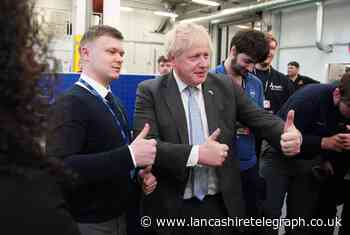 Prime Minister Boris Johnson gets hands on while visiting Burnley Sixth Form College