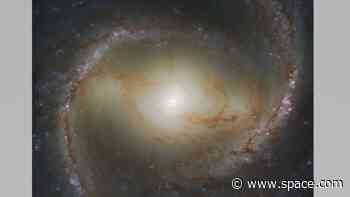 See a behemoth black hole and spiral galaxy like only the Hubble telescope can