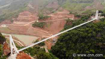 New glass bridge in Vietnam suspends visitors between two mountains