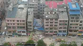 Police arrest 9 after building collapses in central China