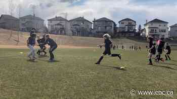 Thousands of Calgary kids kick off their first regular outdoor season in two years - CBC.ca