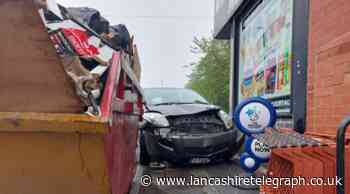 Blackburn: Driver taken to hospital after crashing outside newsagents
