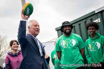 Charles tries American football on visit to charity - St Helens Star