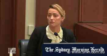 Amber Heard returns to stand for second day