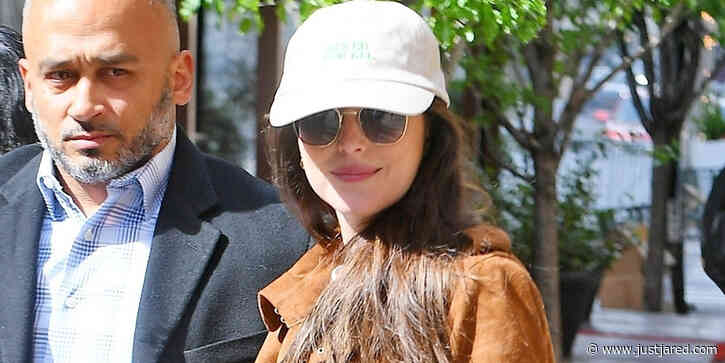 Dakota Johnson Wears Bright White Blazer For A Dinner Meeting in NYC
