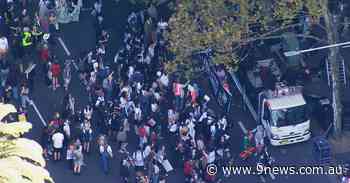 Thousands of students descend on Sydney CBD marching for climate action - 9News