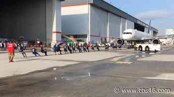 Delta Air Lines employees compete in jet-pulling contest for charity - CBS 46 News