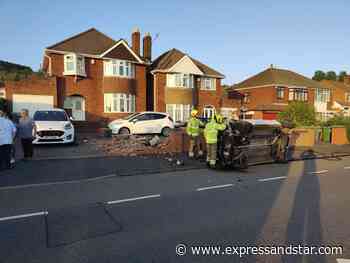Car crashes into brick wall and rolls over in front of Dudley home - Express & Star