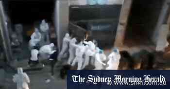 Shanghai’s feared hazmat-clad health workers videoed dragging people from homes