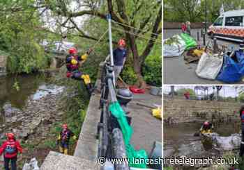 Mountain rescue team and charity clear waste from River Irwell