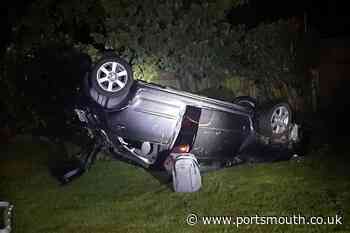Hampshire residents woken by car crashing through fence and flipping - and driver blows over the limit - Portsmouth News