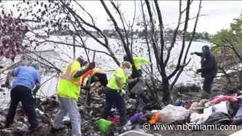 Work Crews Clean Up Massive Trash Pile Along Biscayne Bay