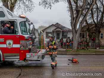 Photos: Firefighters battle blaze in house with no smoke alarms