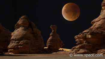 Why does the moon turn red during a total lunar eclipse?