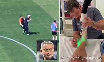 Roma boss Jose Mourinho is left limping after colliding with a player in training