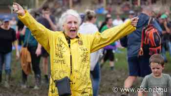 Musicians and crowds rock out in rain, mud at Lismore flood relief concert