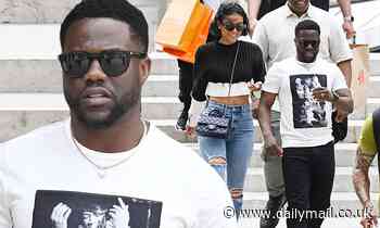 Kevin Hart holds hands with his ab-baring wife Eniko as he takes a break from filming Lift - Daily Mail