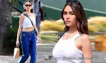 Madison Beer bares her flat stomach in a crop top as she checks out a farmers' market in Los Angeles