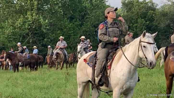 Texas law enforcement on horseback looking for escaped murderer in Leon County